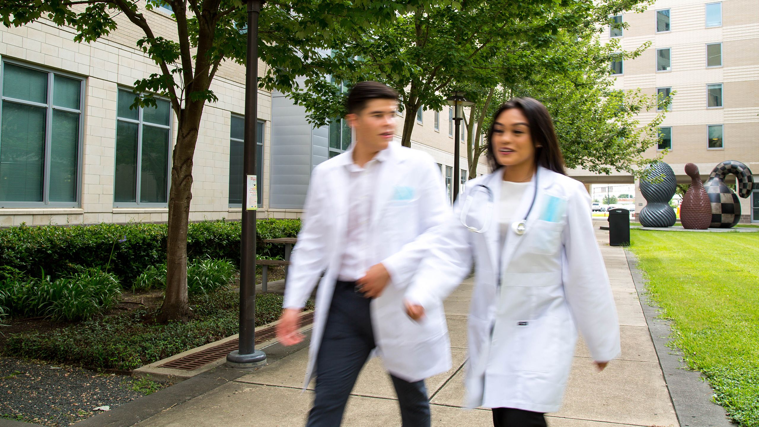 Medical students walking on UH campus